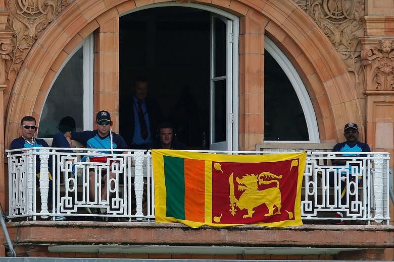 The national flag is draped over the balcony of the Sri Lanka dressing room at Lord's, in protest against an incorrect no-ball call that gave England batsman Alex Hales a reprieve.