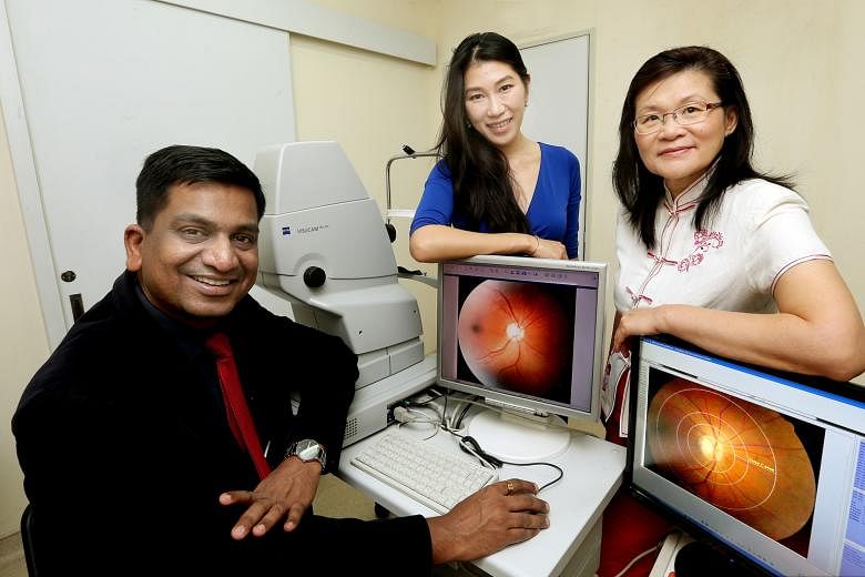 From left: Professor Agrawal, Dr Li and Professor Leo with photographs of retinas that they and collaborators are measuring and analysing for changes in blood vessels morphology associated with dengue infection.