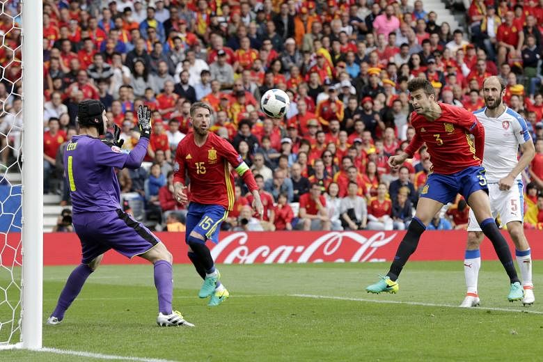 Gerard Pique of Spain (second right) heading home the only goal of the match - and his fifth in total for his country - with just three minutes remaining in the Euro 2016 Group D encounter yesterday.