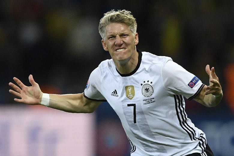Midfielder Bastian Schweinsteiger is ecstatic after scoring Germany's second goal to guarantee three points against Ukraine.