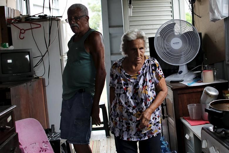 A couple in their 70s inside their shipping-container home in Brazil and (below) an elderly woman out shopping in Beijing. People are living longer and more money has to go into savings.