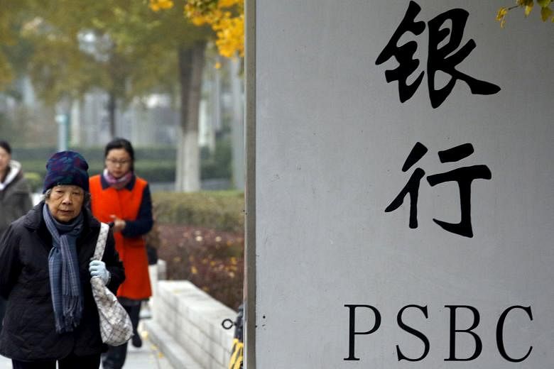 The Postal Savings Bank of China has more than 40,000 branches nationwide, including this one in Beijing, and has about 500 million customers.