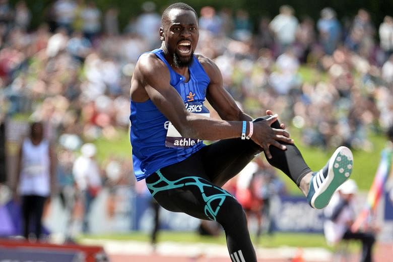 Former triple jump world champion Teddy Tamgho clutching his knee in agony after breaking his leg at the French athletics championships on Saturday. The Frenchman is expected to be out for at least six months.
