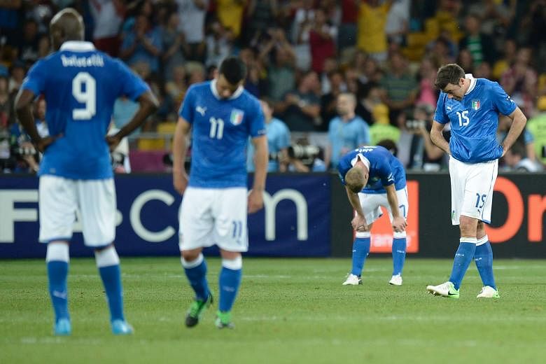 The Italy players' body language says everything about the agony of defeat in this image, taken moments after Spain scored their final goal in the 4-0 rout of the Azzurri in the Euro 2012 final in Kiev.