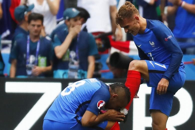 France's Dimitri Payet kissing the left boot of his team-mate Antoine Griezmann after the forward's second goal of the game completed his side's 2-1 comeback victory over Ireland, having gone behind to a Robbie Brady penalty after just two minutes. T