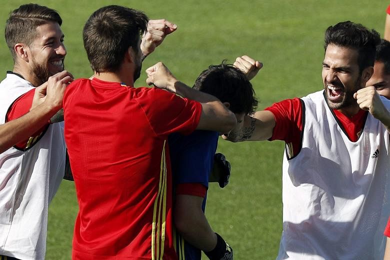 Spain's (from left) Sergio Ramos, Gerard Pique, Iker Casillas and Cesc Fabregas sharing a lighter moment in training ahead of their last-16 tie with familiar foes Italy. The Spanish hold the upper hand in the form book, having met and defeated the It
