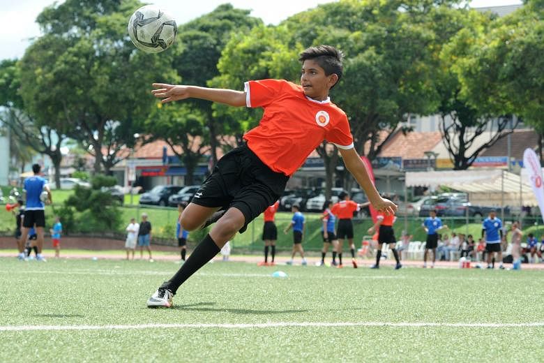 Delhi Public School (International) captain and striker B.K. Harieshvaran and trainees from all five ActiveSG football academies got together at Serangoon Stadium yesterday to show what they had learnt from the programme.