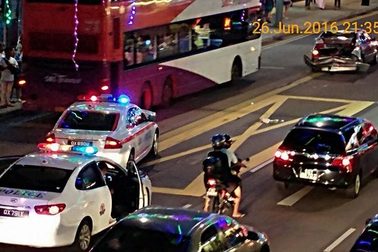 A Traffic Police patrol vehicle (with orange stripes) collided with a BMW (top right of picture) while allegedly in pursuit of another car - said to be a Subaru - on Sunday night. The driver of the Subaru was arrested yesterday for dangerous driving 
