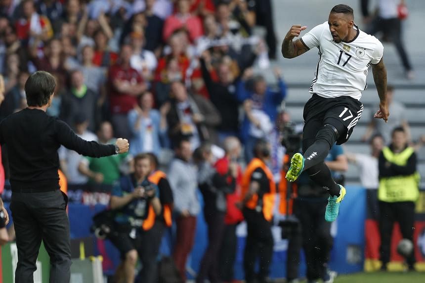 Left: Julian Draxler (left) volleying home to open his account at Euro 2016 and seal Germany's 3-0 win over Slovakia. The midfielder also capped his performance with an assist for Mario Gomez and was named as Uefa's Man of the Match. Below: Defender 