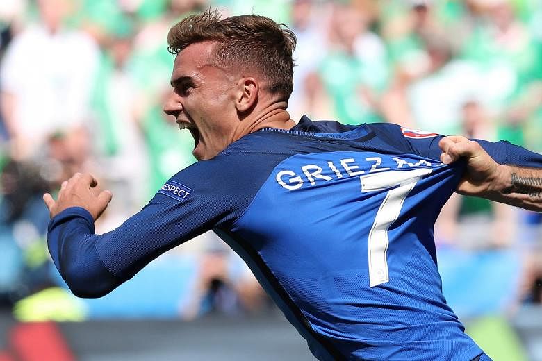 France's Antoine Griezmann celebrating after scoring a goal against Ireland. He scored both goals in the 2-1 last-16 victory.