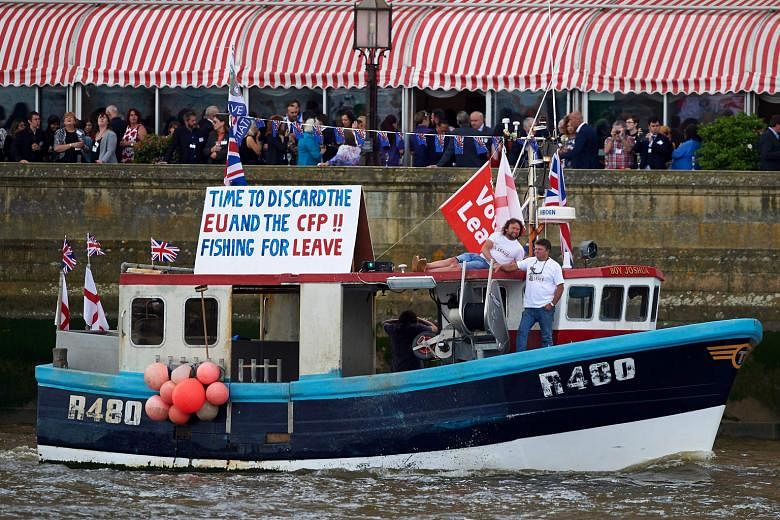 Stay: A boat carrying supporters of the IN campaign to remain in the EU sailing past the Tower of London on the River Thames on June 15. Leave: A boat decorated with flags and banners from a group campaigning for a "leave" vote in the EU referendum s