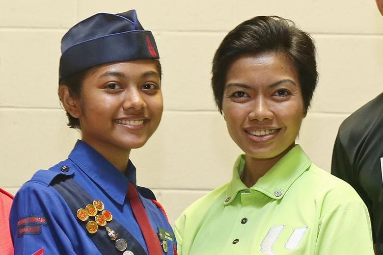 Far left: Vaishali is a first-time participant in the Girls' Brigade contingent. Left: Ms Siti has been taking part in the NDP for more than 10 years.