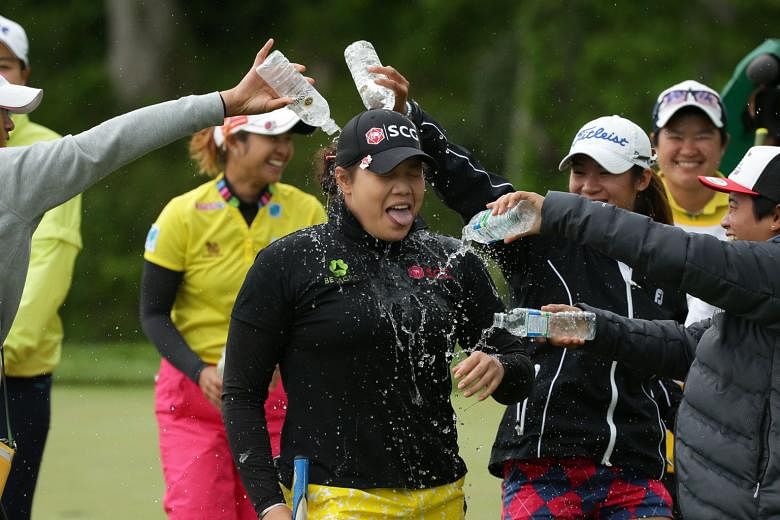 Fellow golfers dousing Ariya Jutanugarn with water after the Thai won the Kingsmill Championship in Virginia in May.