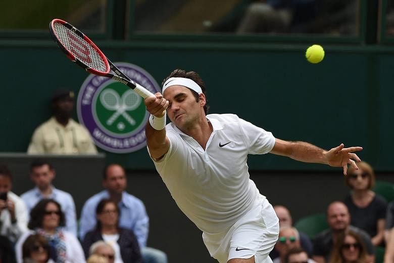 Switzerland's Roger Federer in action against Steve Johnson of the US in their fourth-round match at Wimbledon. The Swiss won 6-2, 6-3, 7-5.