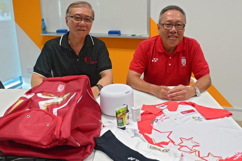 Ho Cheng Kwee (left), Singapore's Paralympics chef de mission and Low Teo Ping, who will lead the Olympic team, with special items such as arm and calf sleeves, insect repellent and permethrin solution.