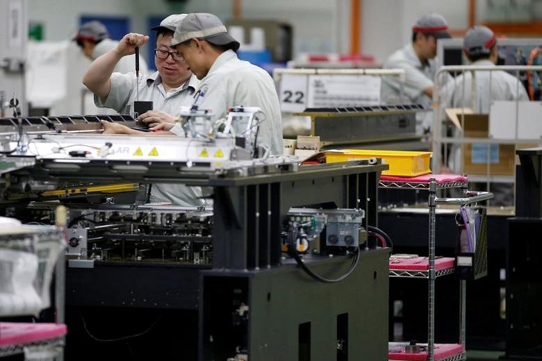 A printed circuit board assembly factory in Singapore. Domestic and export orders shrank last month.