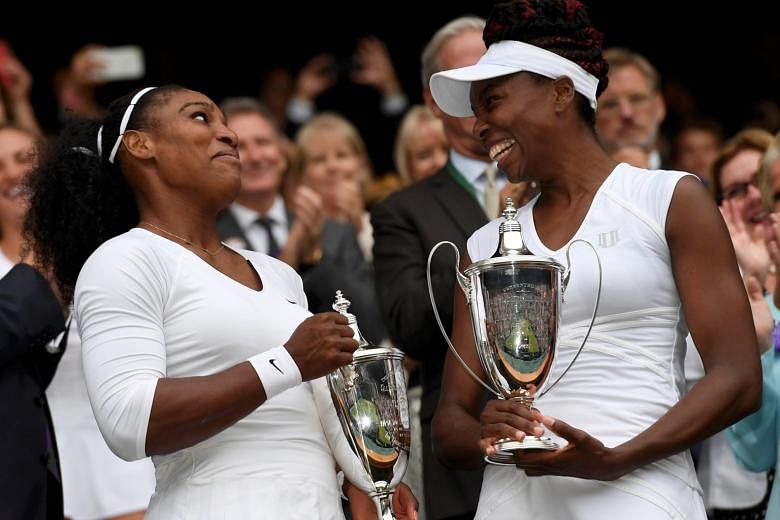Serena and Venus Williams celebrate winning their doubles final against Hungary's Timea Babos and Kazakhstan's Yaroslava Shvedova. It was Serena's 38th Grand Slam title in total.