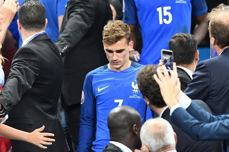 France forward Antoine Griezmann, who scored six goals at Euro 2016, shows his disappointment after the home side were beaten 1-0 by Portugal in the final at the Stade de France in Saint-Denis, north of Paris, on Sunday. Devastated French supporters 