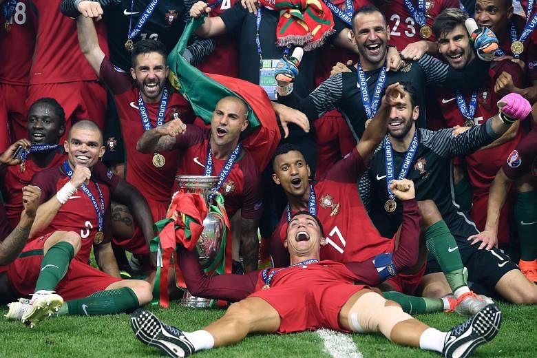 Revelling in the moment of triumph after the 1-0 victory against France, the injured Cristiano Ronaldo (lying down) is flanked by Nani (No. 17), goal-scorer Eder (extreme left), Pepe (second from left) and Ricardo Quaresma (fourth from left).