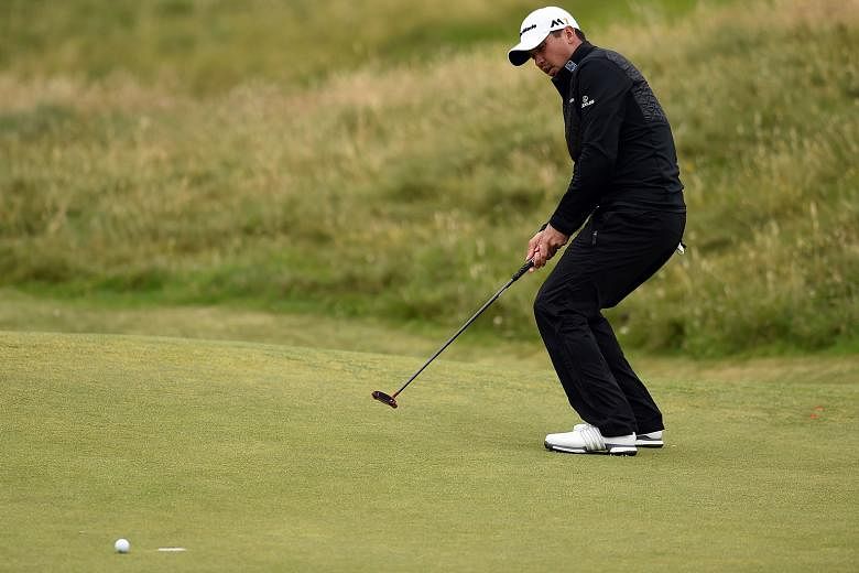 The body language says it all, as Australia's Jason Day shows the anguish of missing his birdie putt on the eighth green during the third round of the British Open at Royal Troon. The world No. 1 had a 71 that left him at one-over 214.