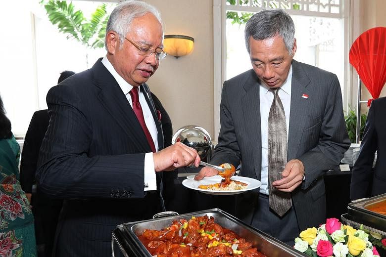 Mr Lee at a lunch hosted by Mr Najib at Seri Perdana in Putrajaya, where a memorandum of understanding on the high-speed rail was inked yesterday.