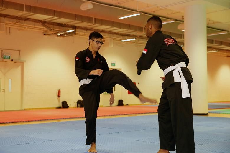 Nur Alfian Juma'en, The Straits Times' Star of the Month, at a silat training session. The 19-year-old won the Asian Pencak Silat Championships last month despite fracturing his hand early in the final.