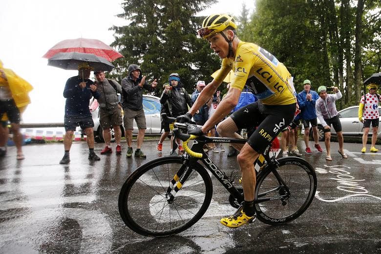 British rider Chris Froome of Team Sky wears the overall leader's yellow jersey during Stage 20 of the Tour de France, a 146.5km section from Megeve to Morzine-Avoriaz, on Saturday.