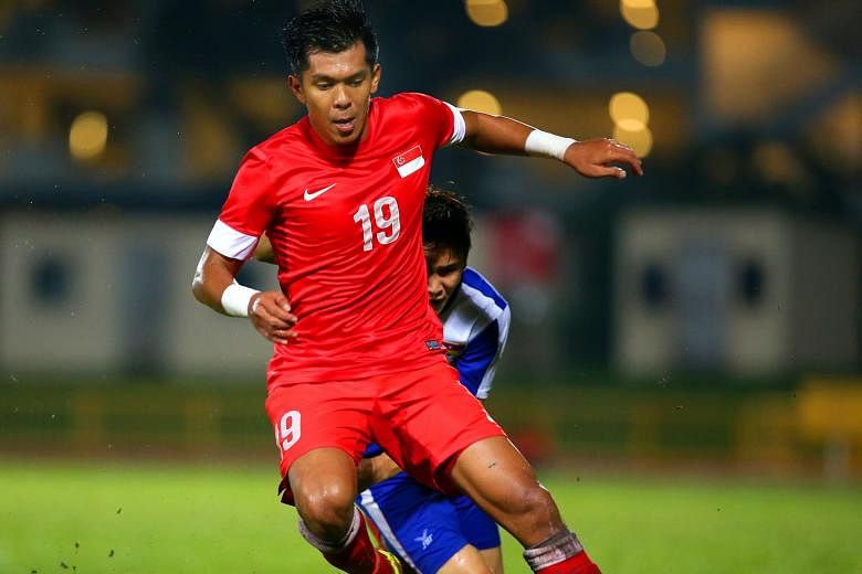 Khairul Amri (left) and Fazrul Nawaz had trouble connecting with the stray high balls pumped forward, as Singapore were beaten 2-1 by Cambodia in Phnom Penh yesterday. But Amri did net the equaliser in the 23rd minute.