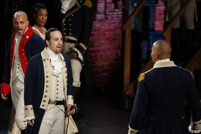 Lin-Manuel Miranda (third from left), founding father of Hamilton, performs with the cast at the Tony Awards in June.
