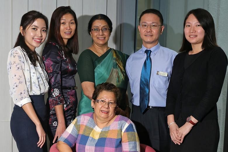 Madam Lyda Bakar Mathilda surrounded by some of those involved in the study (from left) coordinator Nurfaziela Zainal, co-director Dr Loh Ping Tyug, director Prof A. Vathsala, co-director Dr Lim Chee Kong and manager Samantha Ong.