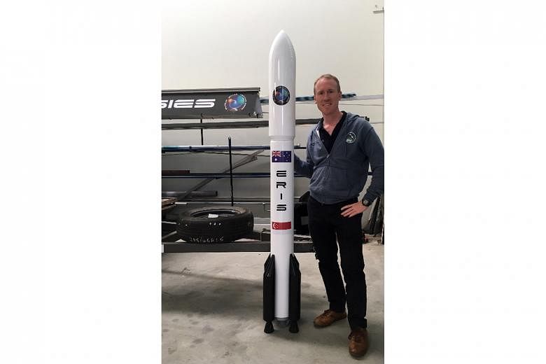 Mr Adam Gilmour, co-founder of home-grown start-up Gilmour Space Technologies, which successfully launched a self-made rocket in Australia two weeks ago. Mrs Gilmour (seated, centre) with design engineer Choo Pui Kim (right), 27, SUTD-MIT Internation