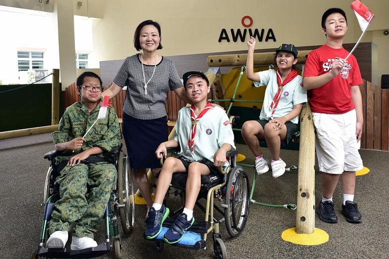 Mrs Seah with her students (from left) Joshua Ng Cai Ming, 16; Malcom Yew Kai, 15; Sarah Nurul Ain Ismail, 12; and Chin Ming Hui, 14. She started structured CCAs for the school's students. Now, there are 18 such CCAs in areas such as sports and the a