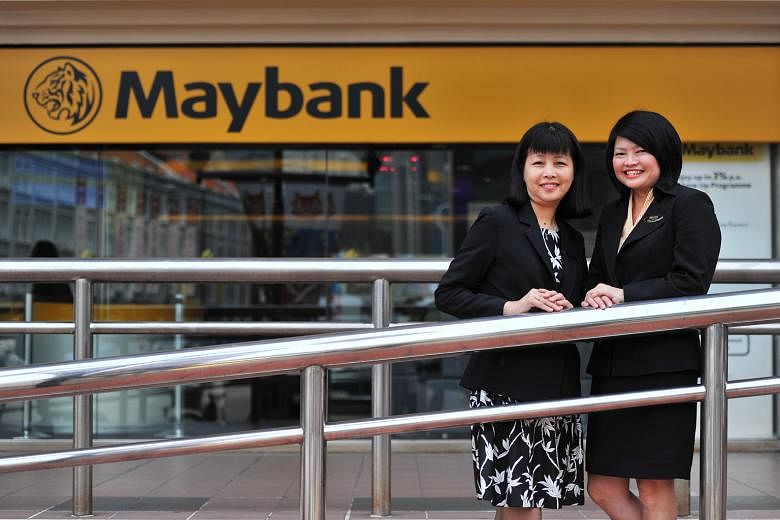 Ms Ong (left) and Ms Ting, staff at the Maybank branch in Chinatown, spent nearly an hour getting information from the 72-year-old woman who wanted to withdraw $200,000 in cash to help a friend "facing an issue with foreign immigration". The bank sta