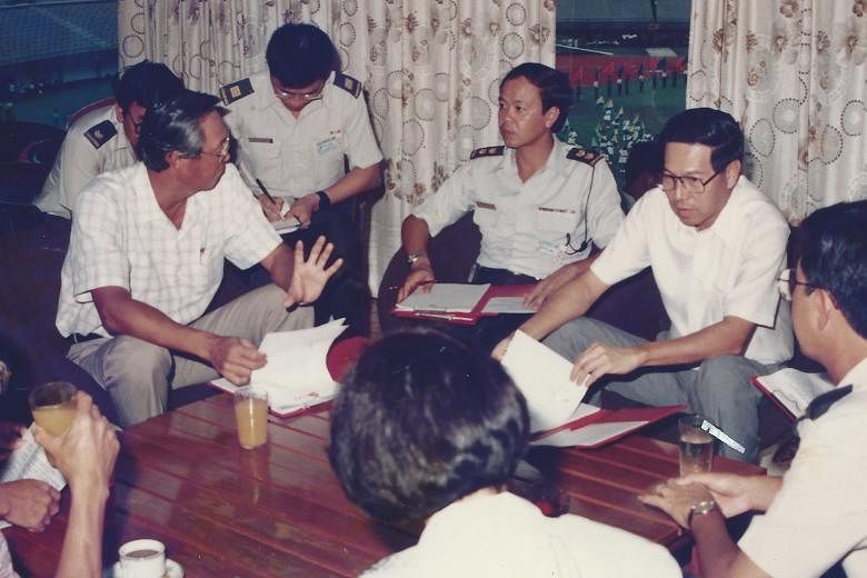 Mr Wong (centre, in uniform) talking to then First Deputy Prime Minister and Minister for Defence Goh Chok Tong and Second Deputy Prime Minister Ong Teng Cheong during an NDP rehearsal. Mr Wong, 65, at the new National Stadium. In 1989, he was the ch