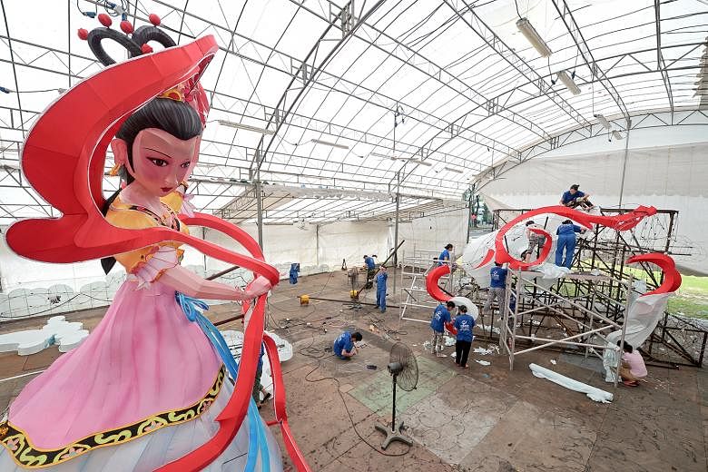 Craftsmen from China's Sichuan province working on a lantern in the shape of the Chinese moon goddess Chang'e, which will be the centrepiece of this year's Mid-Autumn Festival. It is among the lanterns designed by the faculty and students from Nanyan