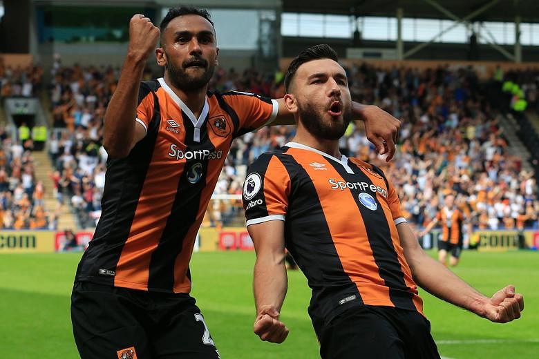 Hull midfielder Robert Snodgrass (right) celebrating with Ahmed Elmohamady after giving their side a lead against Leicester they would hold on to.