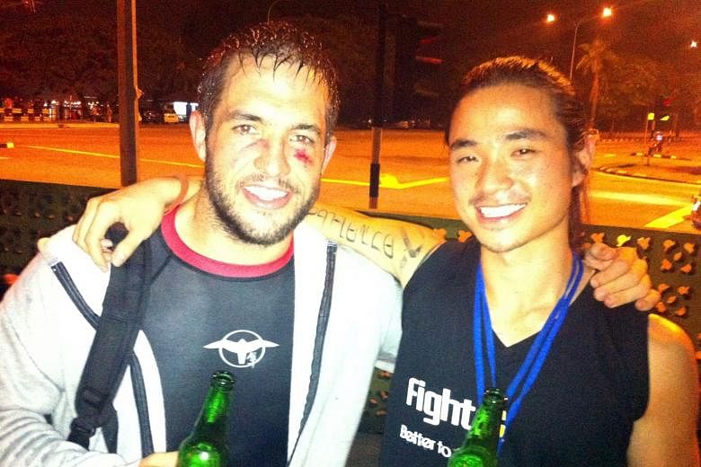 Mr Brad Robinson and Mr Ian Tan after the former's first professional fight and win in 2012.