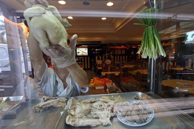 The two Pow Sing eateries in Serangoon Gardens reopened for business yesterday after having had their licences suspended last month over 88 cases of food poisoning.ST PHOTO: SEAH KWANG PENG Mr Lee, a Pow Sing Group director, said the suspension has m