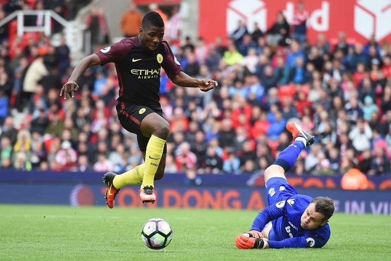 Manchester City's Kelechi Iheanacho taking the ball past Stoke City goalkeeper Shay Given in the build-up to their third goal scored by Nolito. City won the English Premier League match 4-1 with Sergio Aguero and Nolito scoring a brace each, taking t