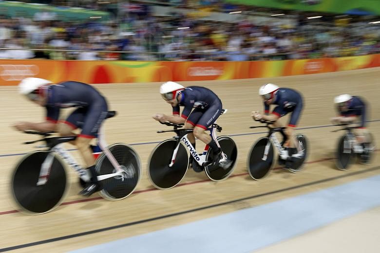Britain's quartet on their way to gold in the team pursuit final against Australia. Cycling requires the most precise timing at the Olympics, taken to a thousandth of a second on the front wheel of the third rider across the line.