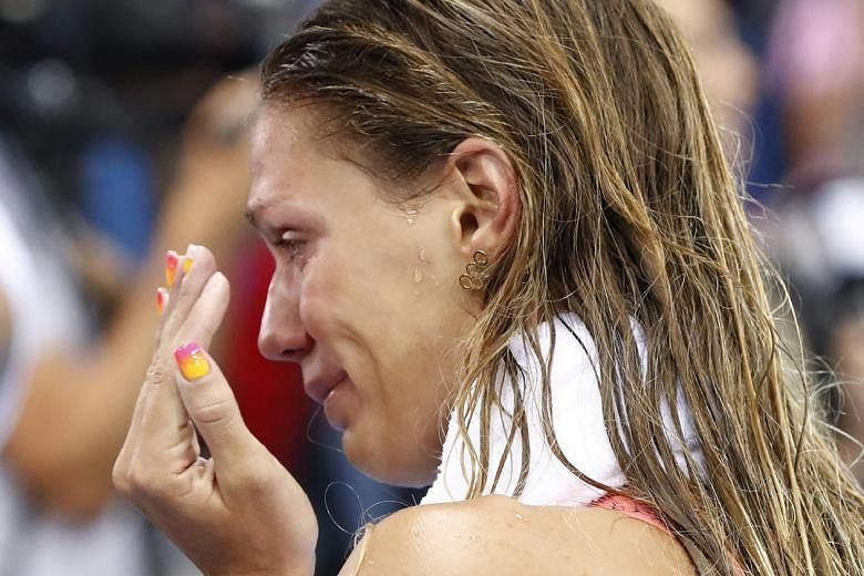Russia's Yulia Efimova in tears after she finished second in the 100m breaststroke final at the Olympic Aquatics Stadium, where she was jeered throughout the race.