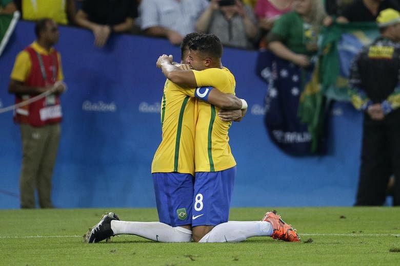 An emotional moment for Brazil captain Neymar and Rafael Alcantara, after the Olympic hosts beat Germany on penalties in the football final at the Maracana.