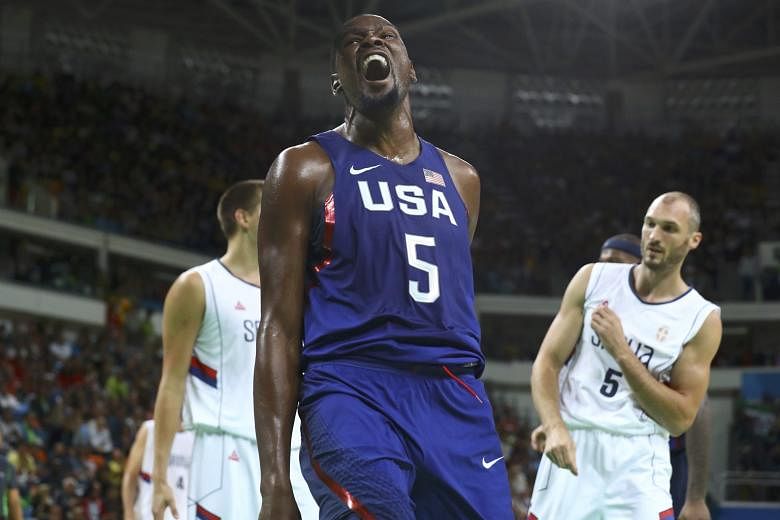 Kevin Durant, the top scorer with 30 points, reacting after a dunk, as Serbia's Marko Simonovic shows his frustration in the final. The gold was the US' 46th and final one in Rio.