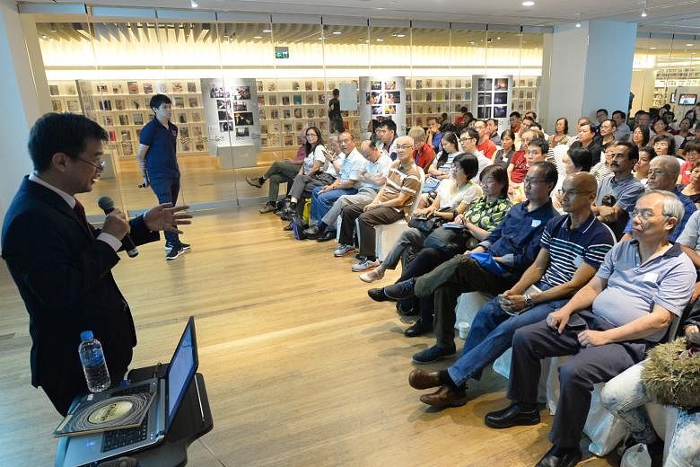 Senior correspondent Mr Goh speaking to 240 people who attended the free talk at the library@orchard yesterday. The next talk on Sept 30, by correspondent Melody Zaccheus, is on preserving Singapore's historic sites.