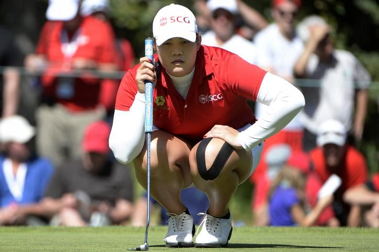 Ariya Jutanugarn lining up her putt on the eighth green during the second round of the Canadian Open. She leads the event by three shots.