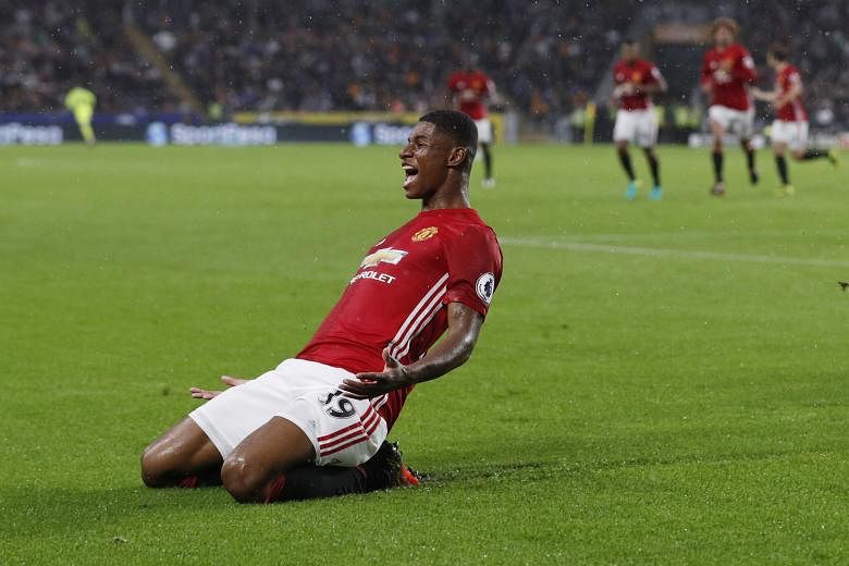 Manchester United's Marcus Rashford celebrating after scoring his team's winner in the 92nd minute during the 1-0 English Premier League victory over Hull City.