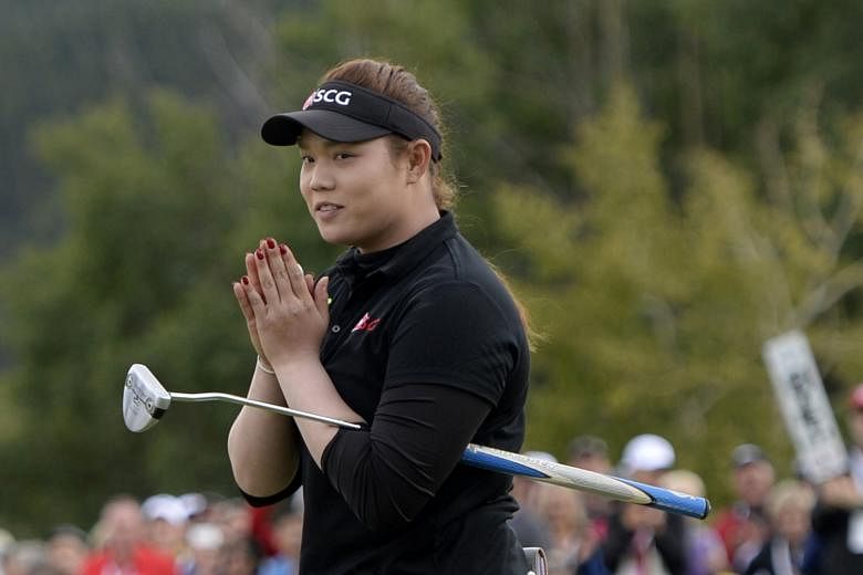 Ariya Jutanugarn of Thailand reacting after sinking her putt on the 18th green during the Canadian Pacific Women's Open final round on Sunday.