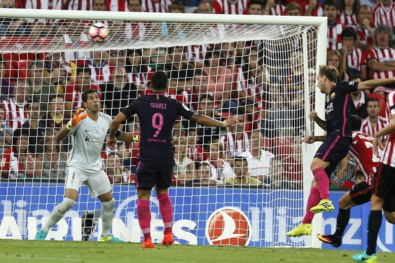 Barcelona's Ivan Rakitic (third from left) scoring the only goal of the match against Athletic Bilbao on Sunday. The arrival of Spain international Paco Alcacer will add more menace to the feted trident of Lionel Messi, Luis Suarez and Neymar.