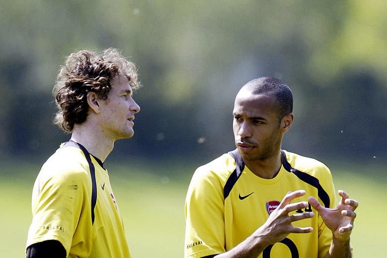 Jens Lehmann (far left) with Thierry Henry during an Arsenal training session back in 2006.