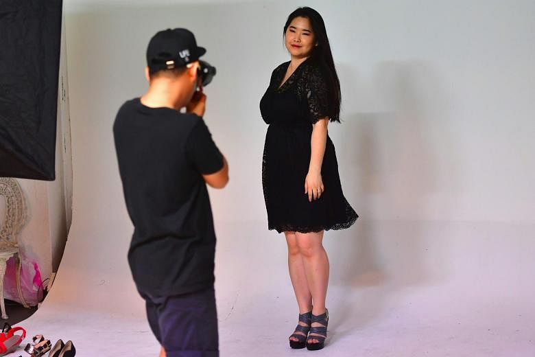 South Korean plus-size model Vivian Geeyang Kim posing for a photo shoot to update her online shop in Seoul.